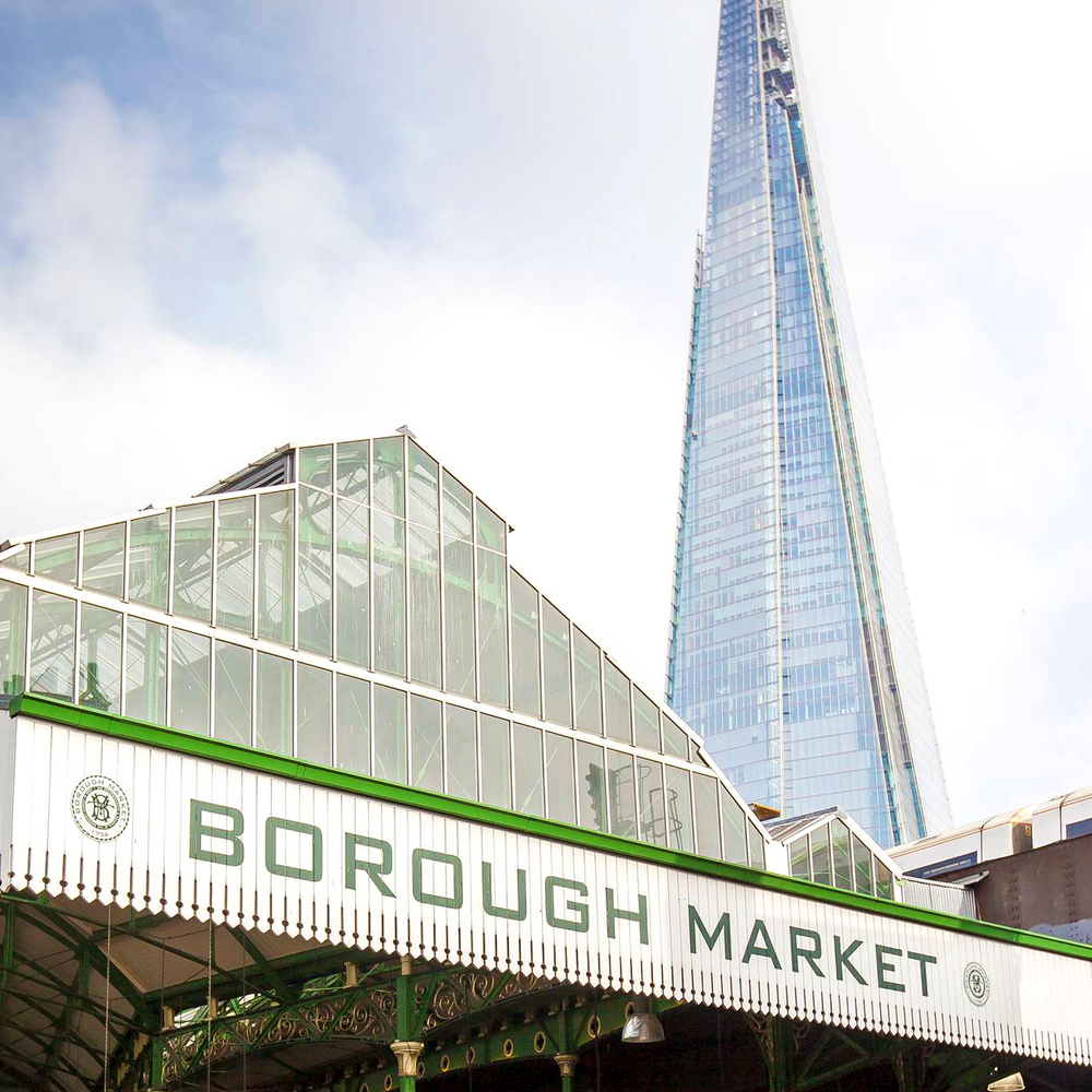 Exterior view of Borough Market, showcasing the vibrant and historic entrance bustling with visitors