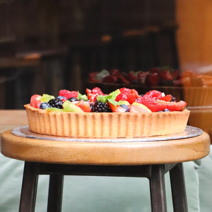 delectable fruit tart filled with summer fruits, blackberries, strawberries and blueberry. 
